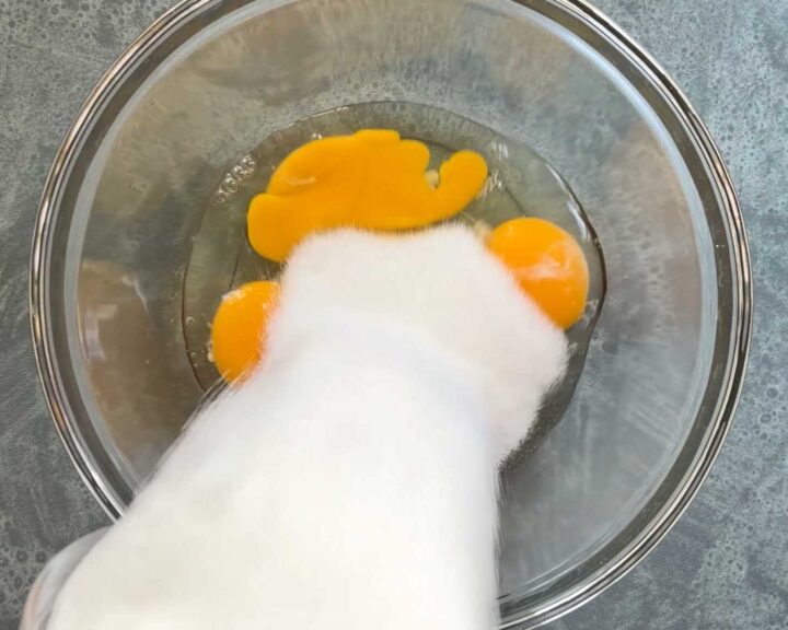 Combine eggs with sugar.