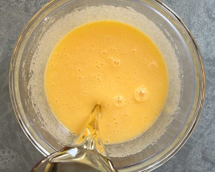 Mix in oil and sour cream.