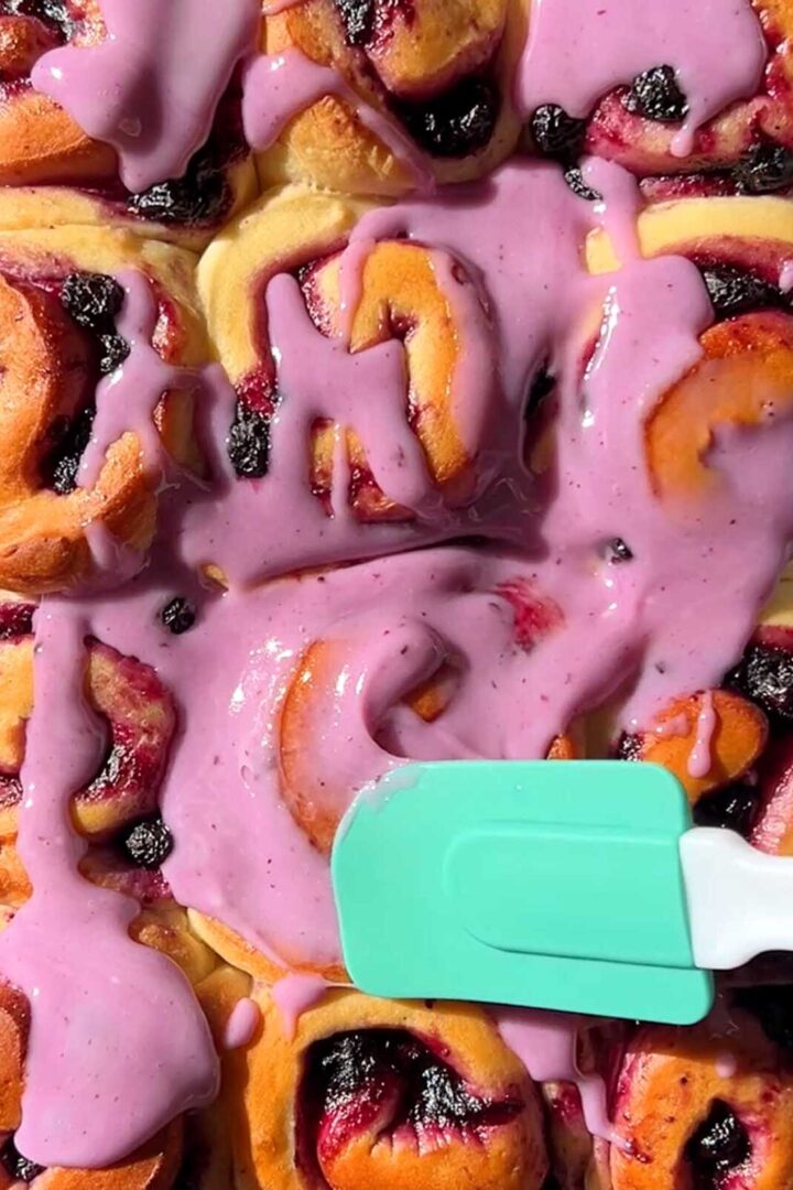 lemon blueberry sweet rolls with blueberry icing on top