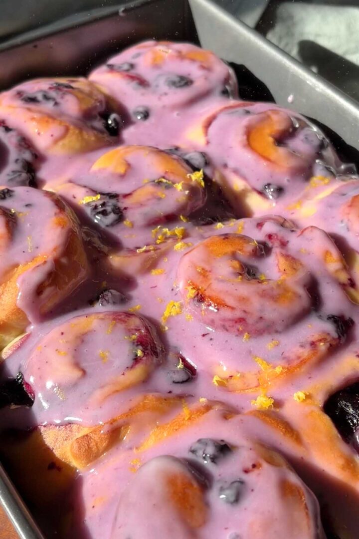 lemon zest over lemon blueberry sweet rolls