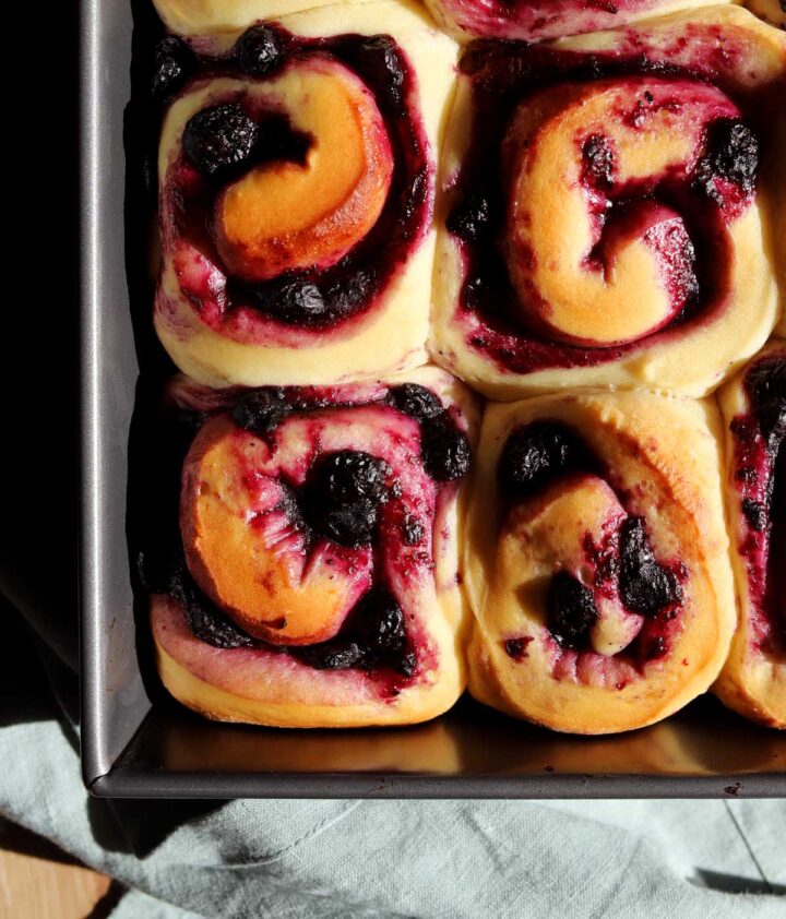 lemon blueberry sweet rolls in baking pan before adding blueberry glaze