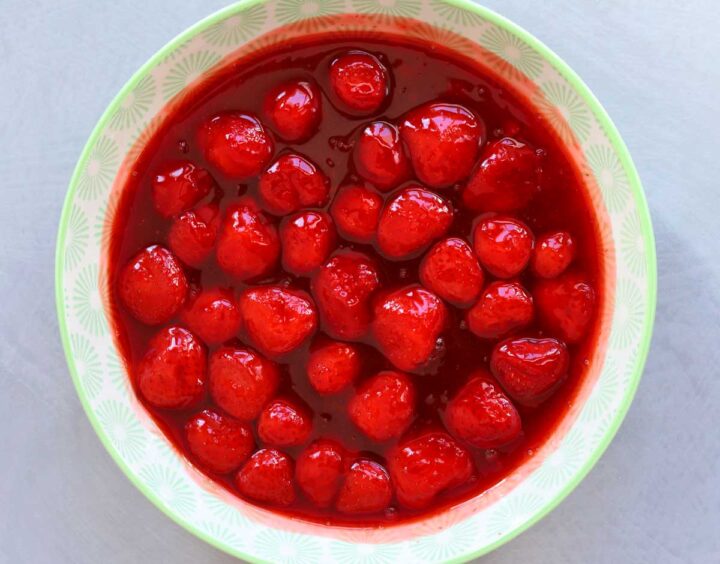strawberry sauce topping for cheesecake in a bowl