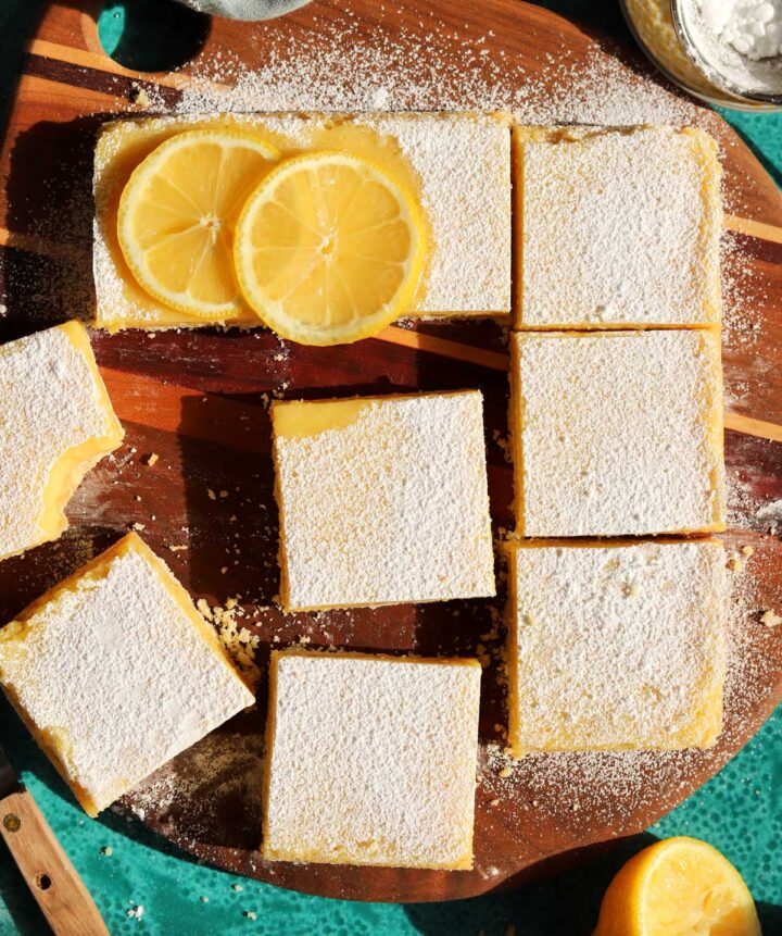 top view of creamy lemon bars sliced on cutting board
