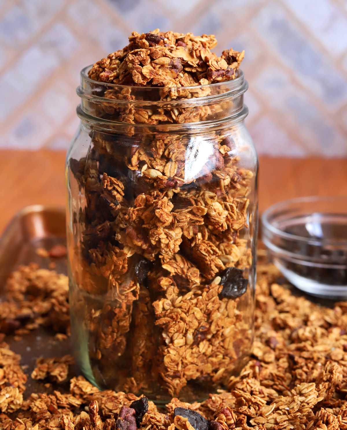 crunchy maple pecan egg white granola in a glass jar