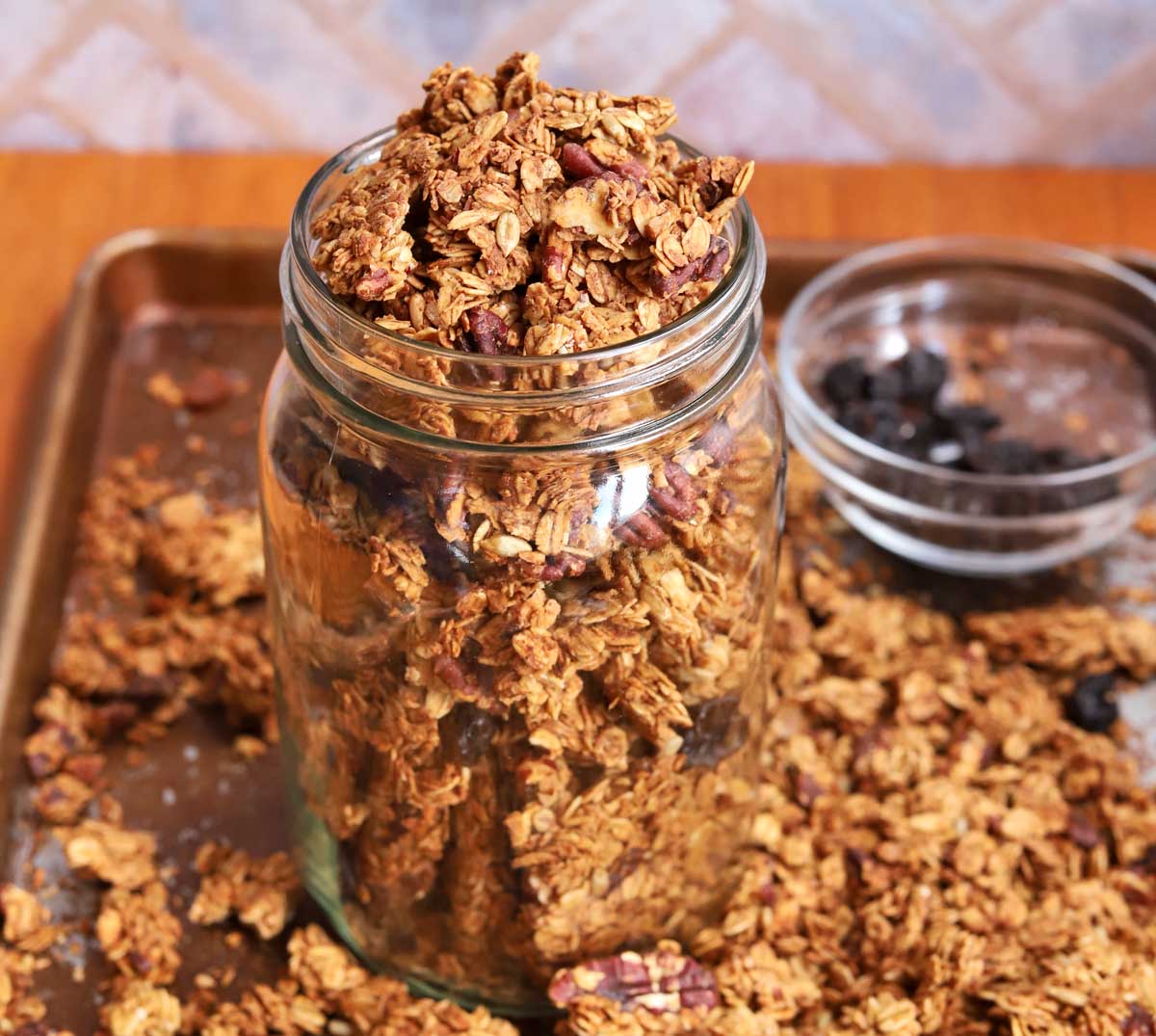 crunchy maple pecan egg white granola in a glass jar