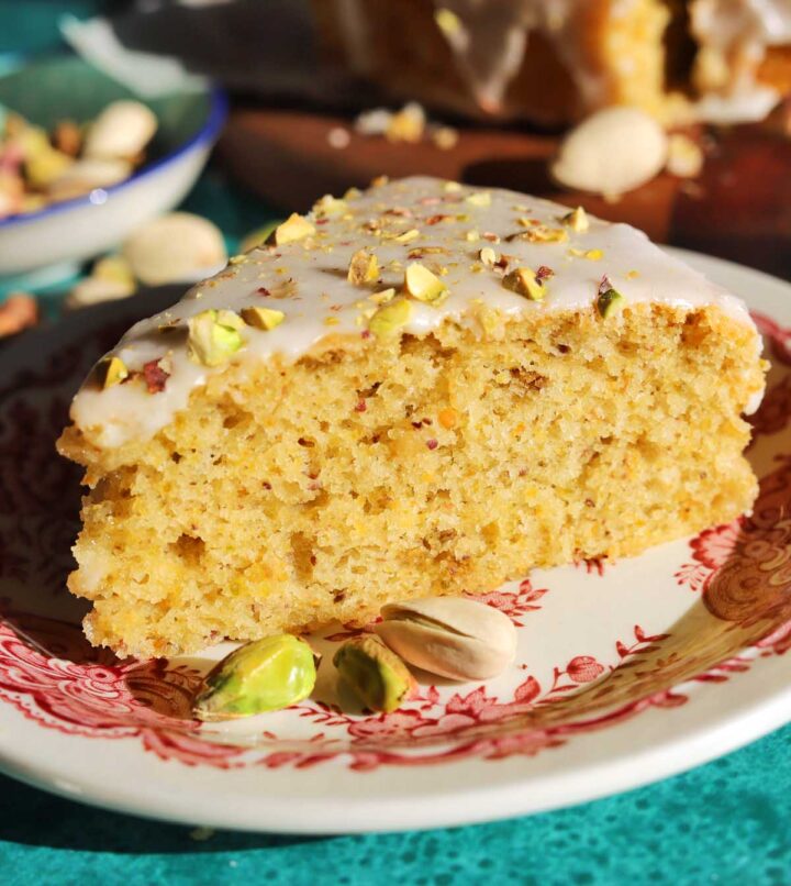 slice of olive oil pistachio cake on a plate