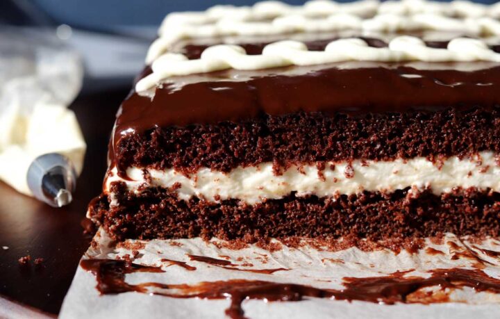 sliced hostess cake on cutting board showing cross section