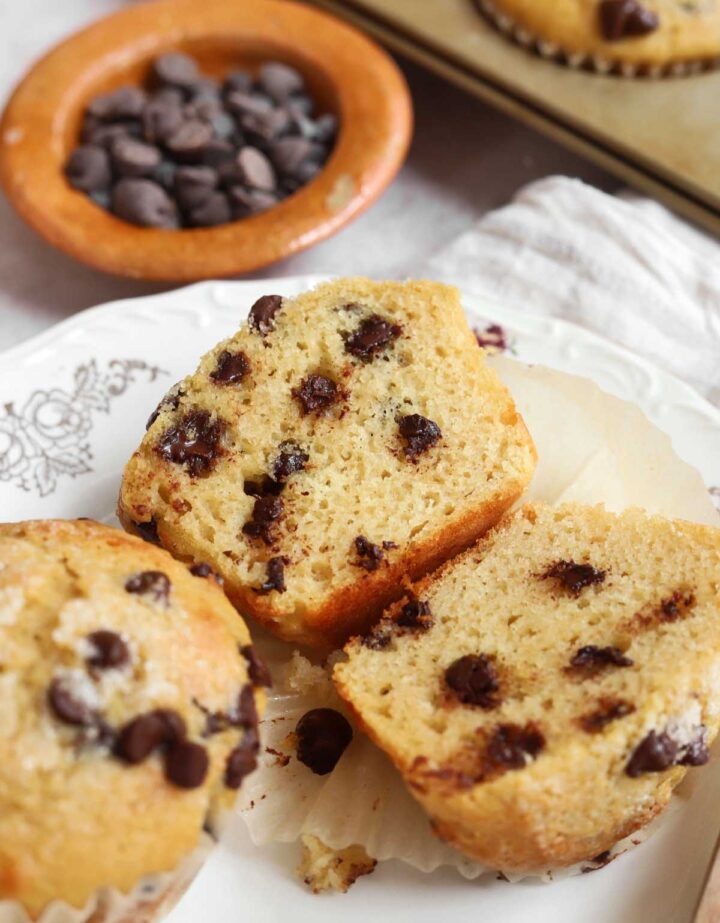 healthy Greek yogurt chocolate chip muffins sliced in half showing crumb texture