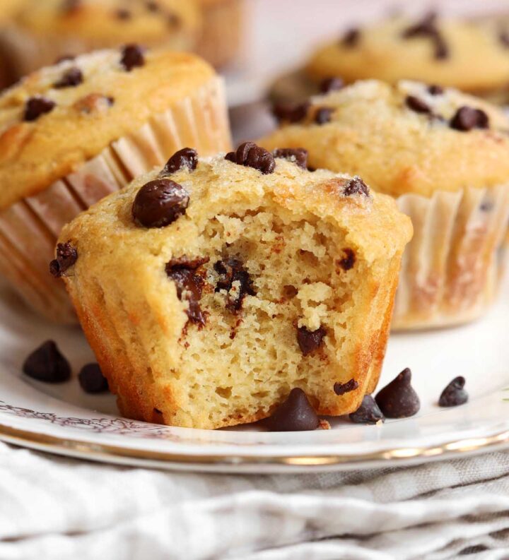 healthy Greek yogurt chocolate chip muffins with bite on a plate