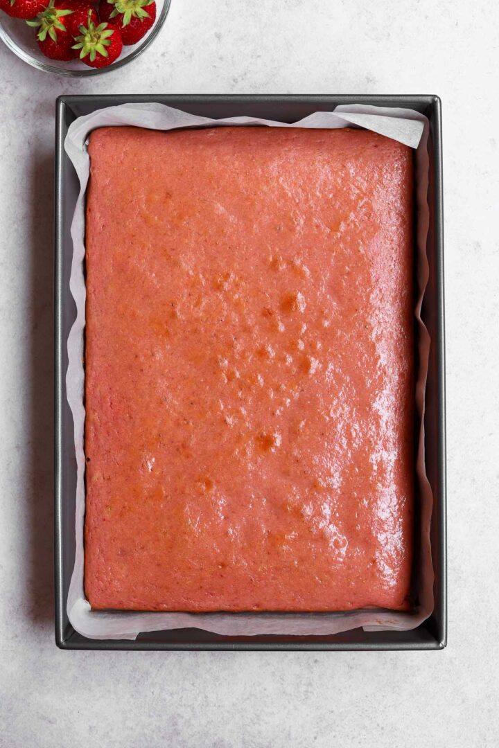 strawberry sheet cake in baking pan just after baking