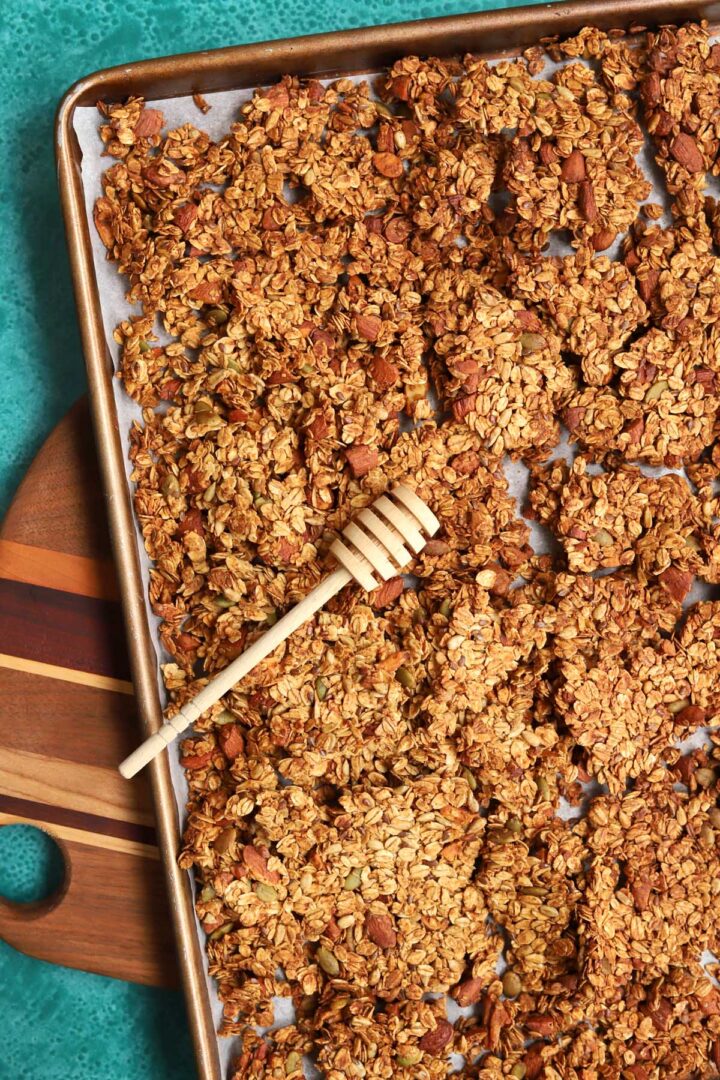 honey almond egg white granola in baking pan and broken into clusters