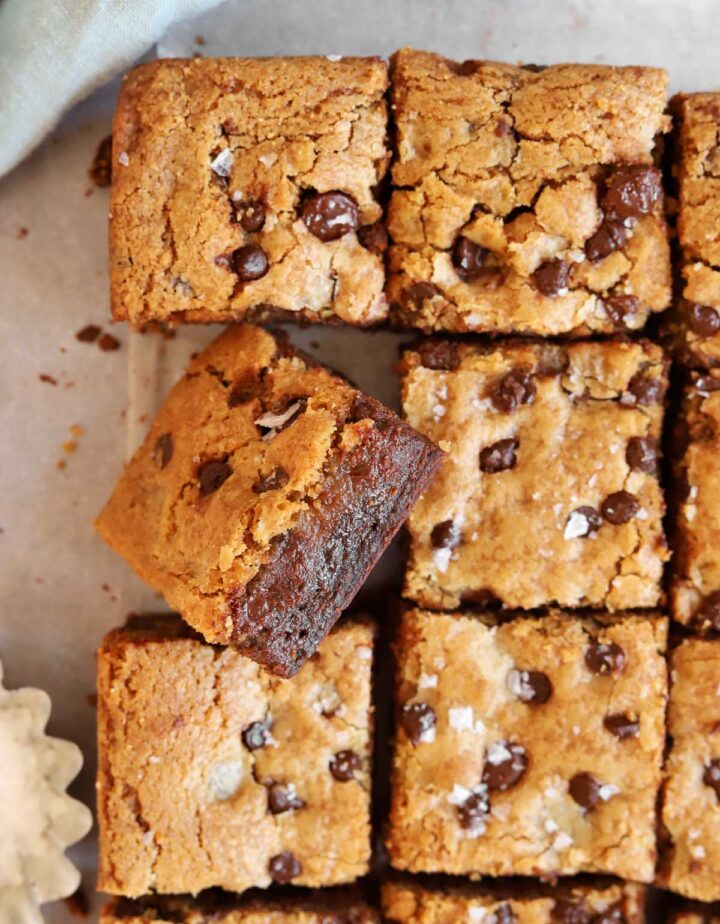 chocolate chip cookie brownies sliced into squares showing fudgy texture