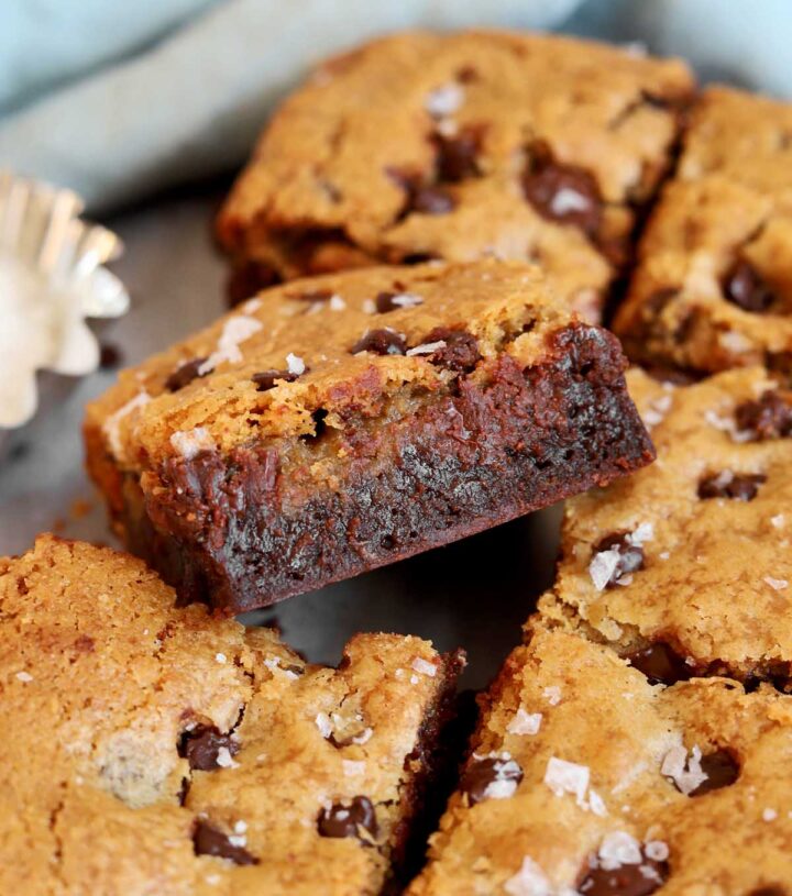 chocolate chip cookie brownies sliced into squares showing fudgy texture