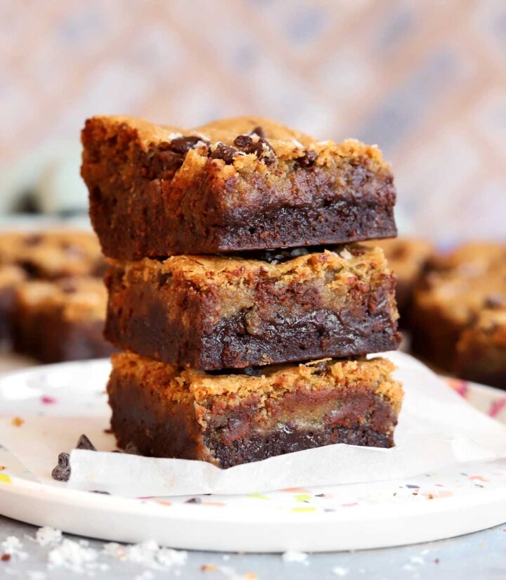 chocolate chip cookie brownies stacked on plate