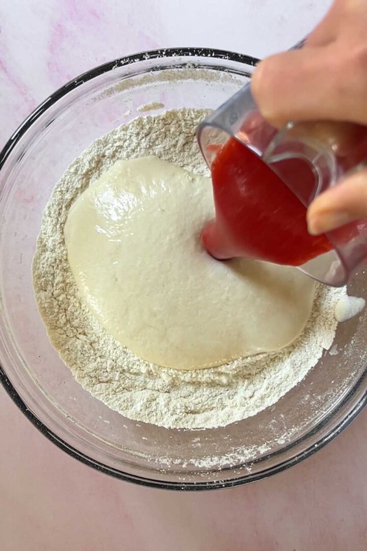 Add egg mixture and strawberry puree to the dry ingredients.