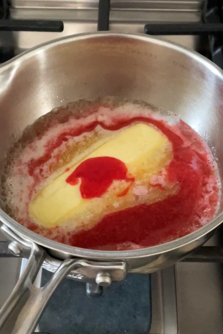 Combine butter and strawberry puree in a saucepan and bring to a simmer.