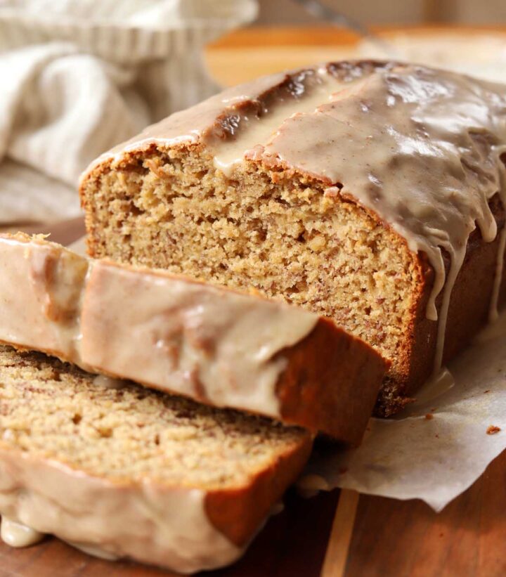 brown butter banana bread sliced on cutting board showing moist crumb texture