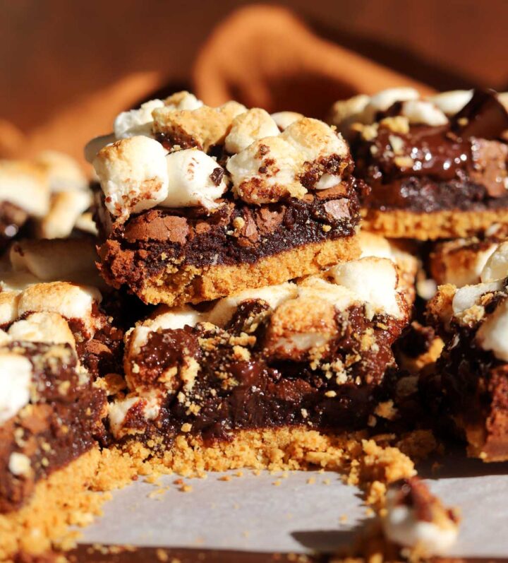 s'mores brownies stacked on cutting board