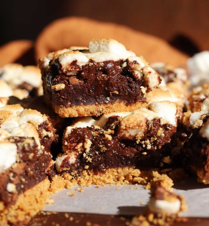 s'mores brownies stacked on cutting board