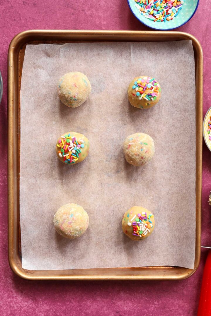 sprinkle sugar cookie dough balls on baking sheet