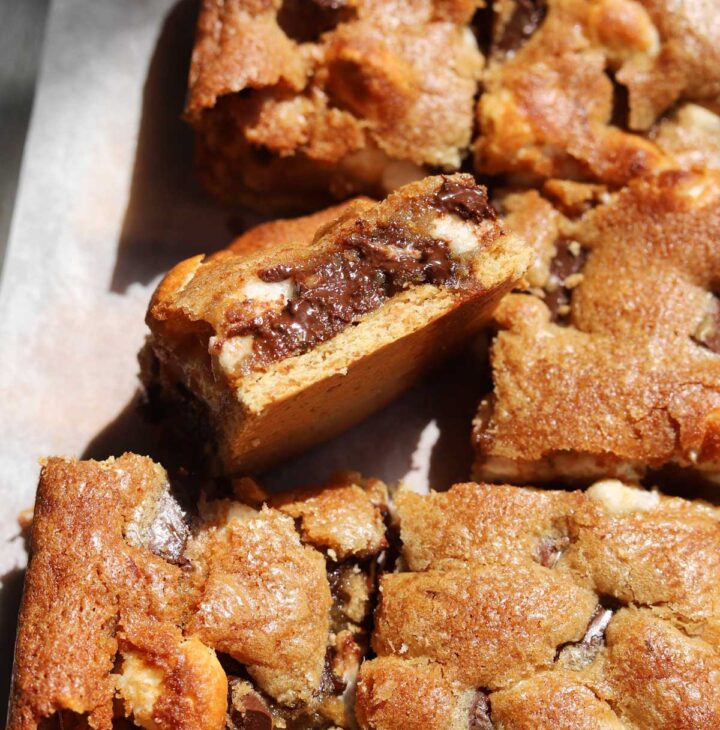 s'mores blondies sliced on cutting board showing square with cross-section