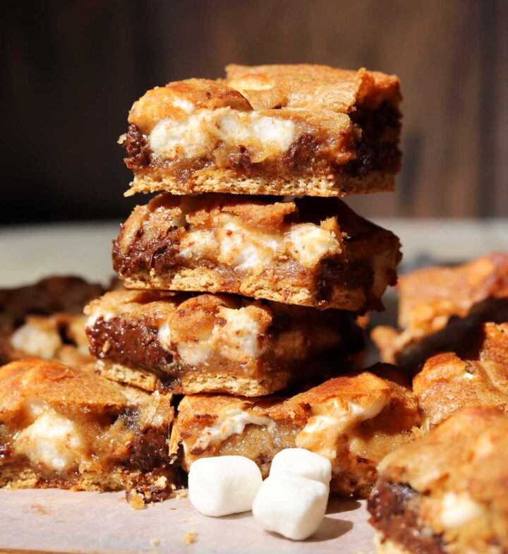 stack of s'mores blondies on parchment paper