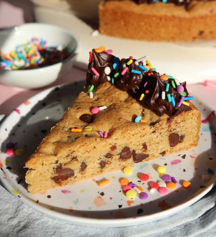 slice of chocolate chip cookie cake on a plate
