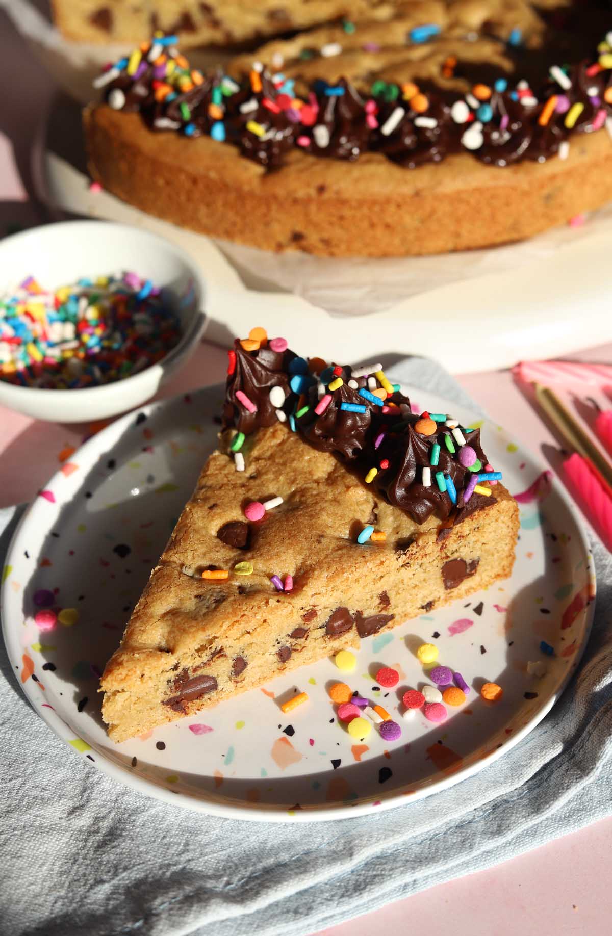 slice of chocolate chip cookie cake on a plate
