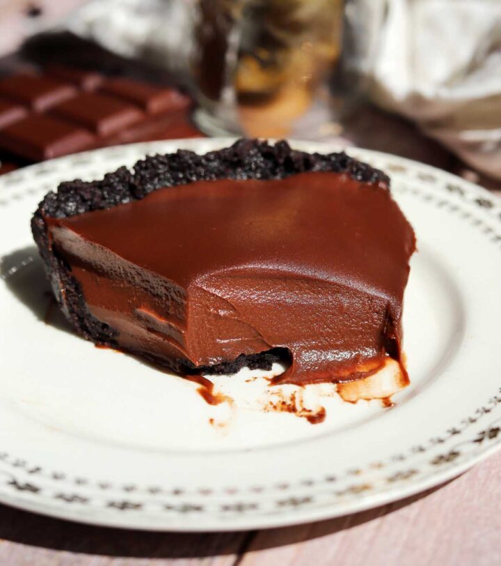 no bake chocolate pie on a plate with bite