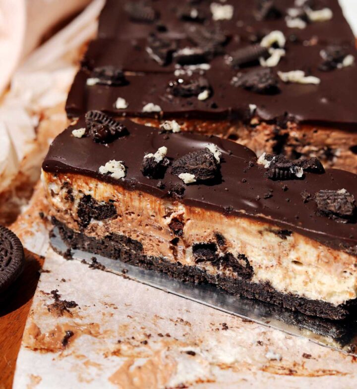 top view of no bake Oreo cheesecake slice on cutting board