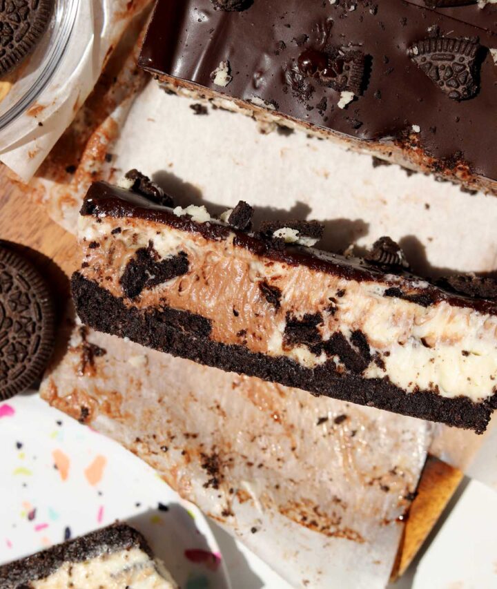 top view of no bake Oreo cheesecake bars slice on cutting board