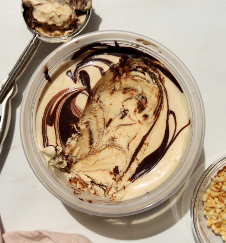 no churn peanut butter espresso fudge ice cream in deli container with scoop