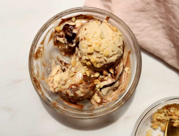 top view of scoops of no churn peanut butter espresso fudge ice cream in a bowl with bite