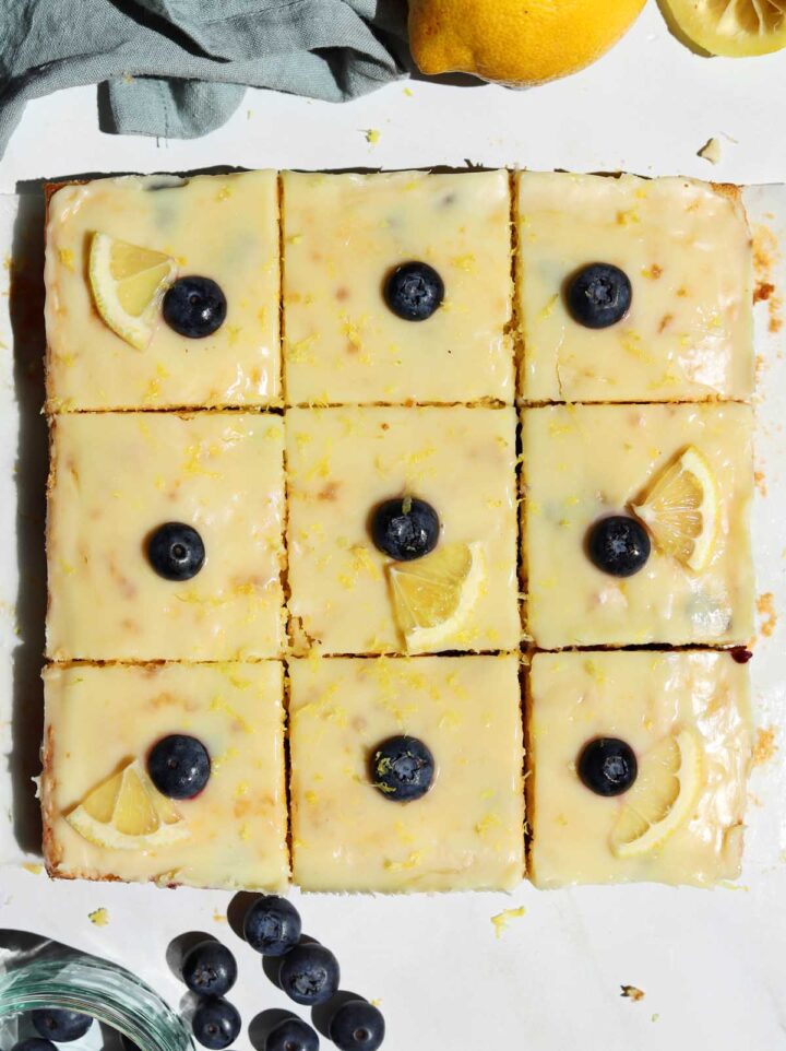 top view of fudgy lemon blueberry brownies sliced on parchment paper