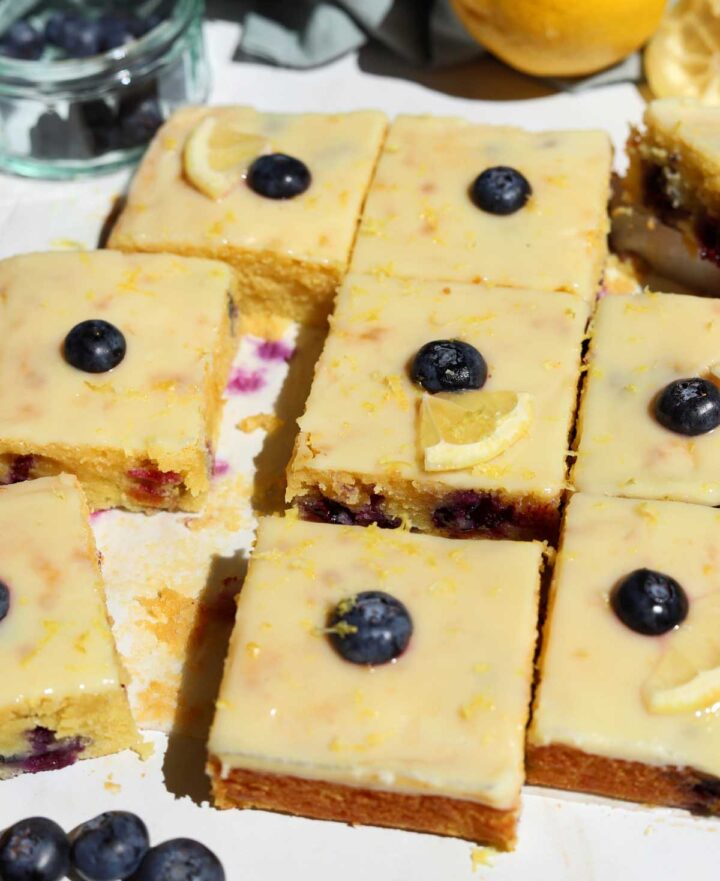 fudgy lemon blueberry brownies sliced on parchment paper