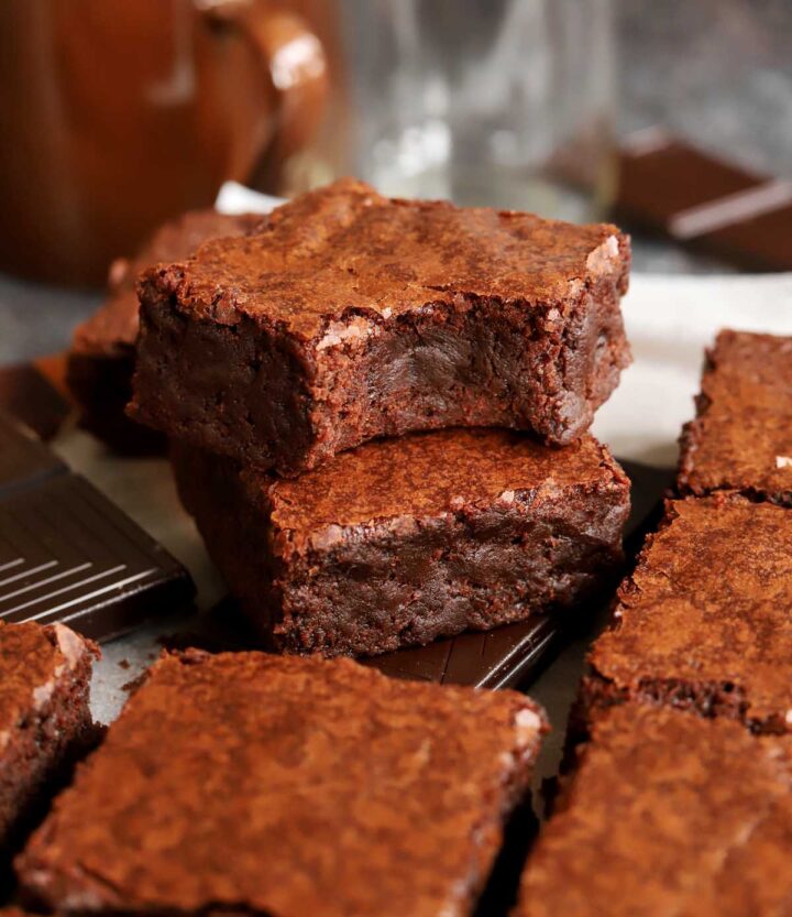 fudgy egg white brownies stacked on parchment paper