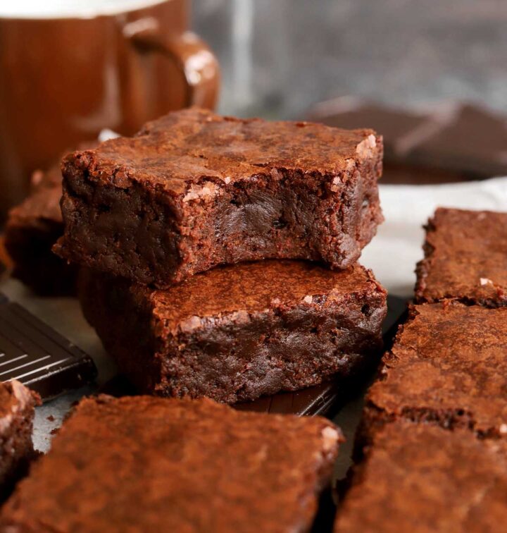 fudgy egg white brownies stacked on parchment paper