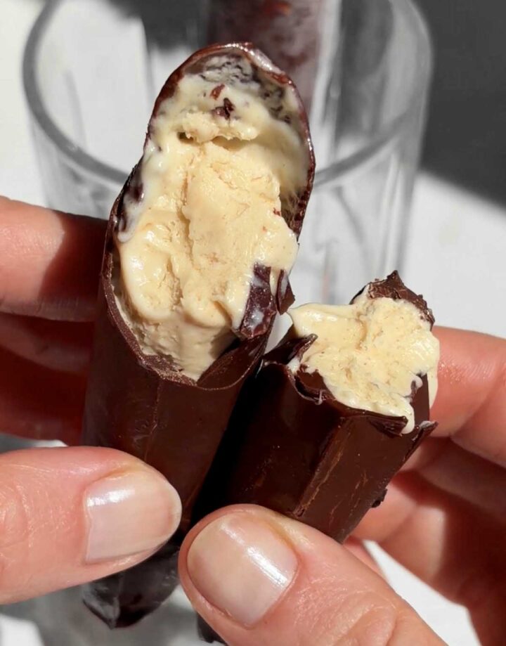 peanut butter ice cream choco bars broken in half showing creamy peanut butter ice cream filling