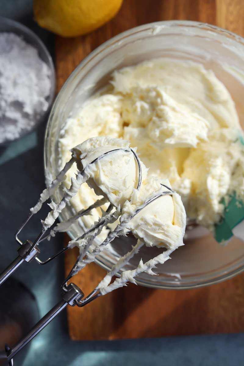 cream cheese frosting on mixer attachment after gradually adding cream cheese