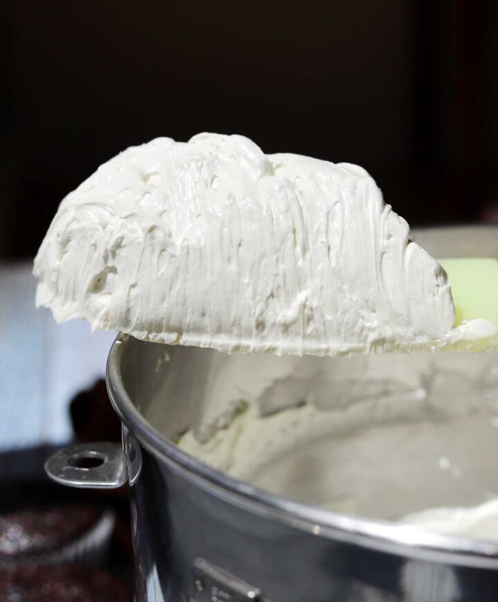 best hybrid vanilla American buttercream on a spatula showing fluffy consistency