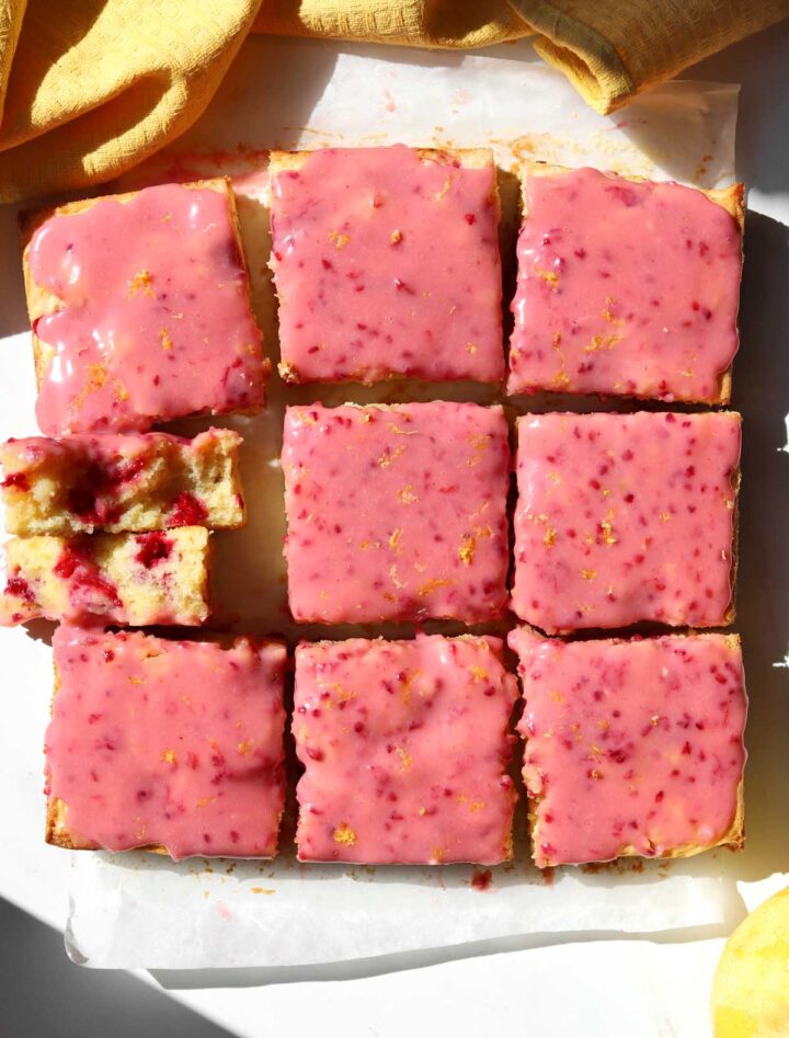 top view of raspberry lemonade brownies sliced on parchment