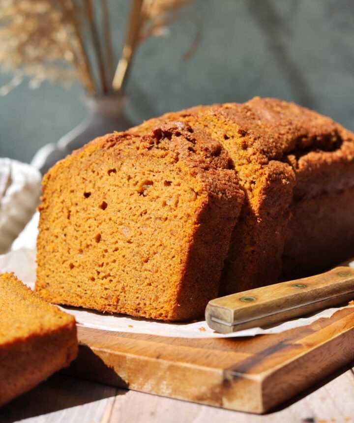 best moist pumpkin bread sliced on cutting board