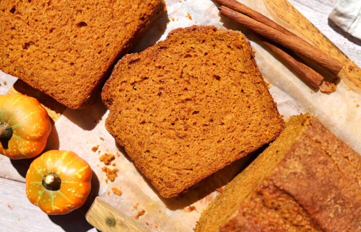 top view of the best pumpkin bread slice on cutting board