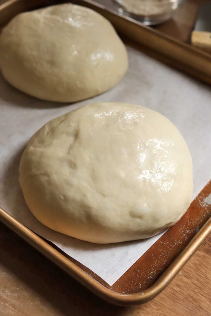 ball of homemade pizza dough after proofing