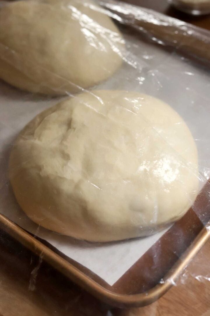 ball of homemade pizza dough after proofing