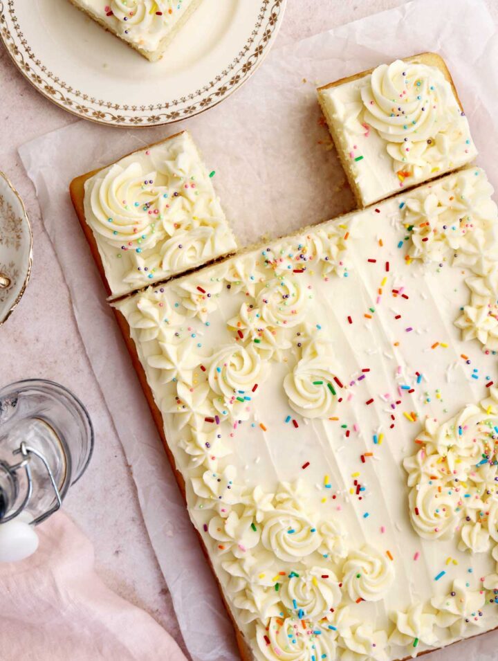 moist vanilla sheet cake with vanilla buttercream frosting and sprinkles