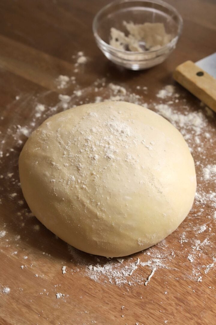 ball of homemade pizza dough after proofing