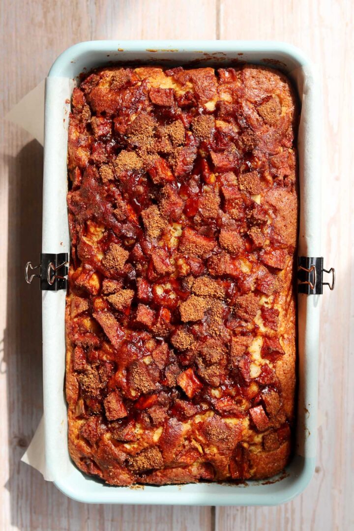 top view of cinnamon apple fritter bread in loaf pan after baking