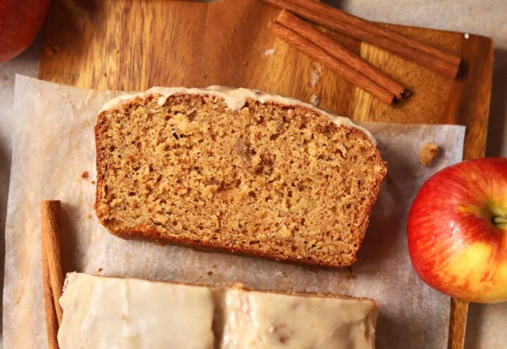 top view of a slice of brown butter apple bread on cutting board
