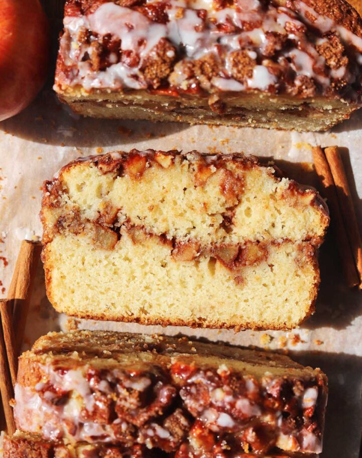 top view of cinnamon apple fritter bread with slice showing cross section